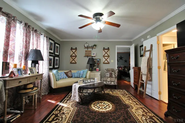 a living room with patio fireplace furniture and a flat screen tv