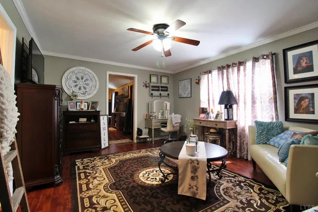 a kitchen with stainless steel appliances kitchen island granite countertop a stove a sink dishwasher a dining table and chairs with wooden floor