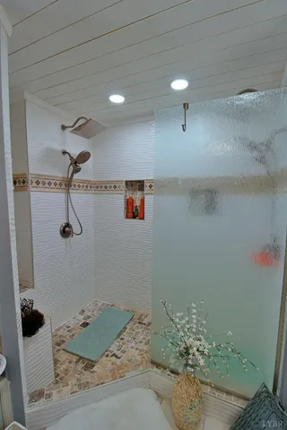 a kitchen with stainless steel appliances granite countertop wooden cabinets a stove top oven a sink and dishwasher