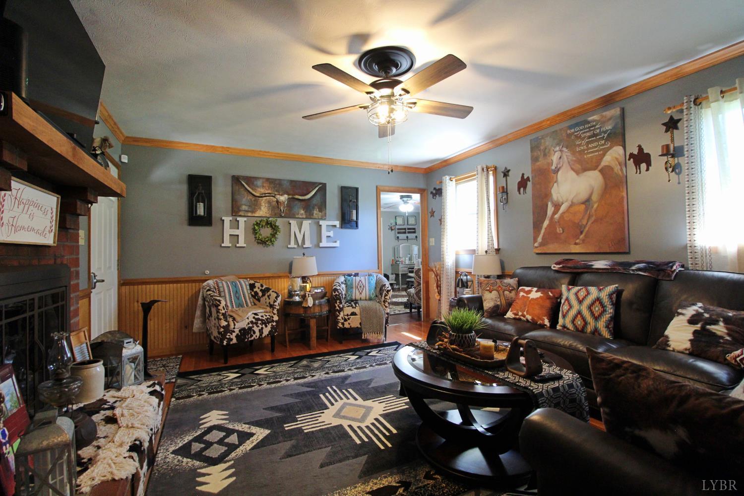 1147 Union Church Road Gladstone, VA 24553 - Photo 20 of 89 a living room with furniture and a flat screen tv