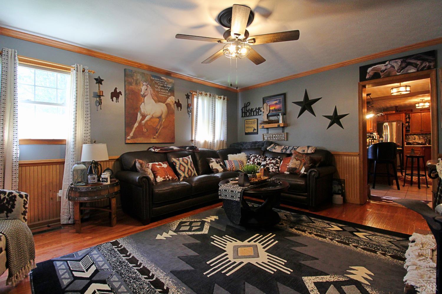 1147 Union Church Road Gladstone, VA 24553 - Photo 21 of 89 a living room with furniture and a chandelier