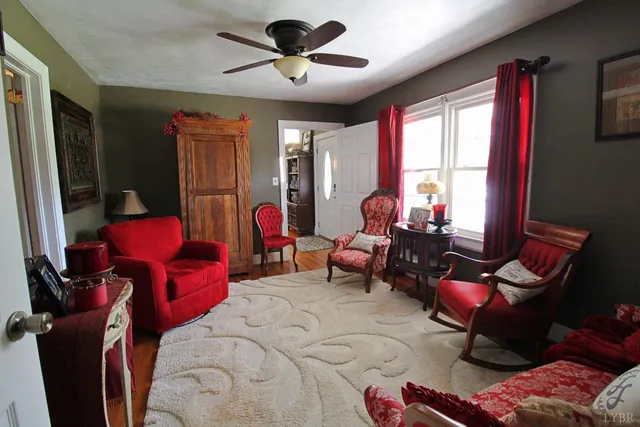 an aerial view of green landscape with trees houses and mountain view
