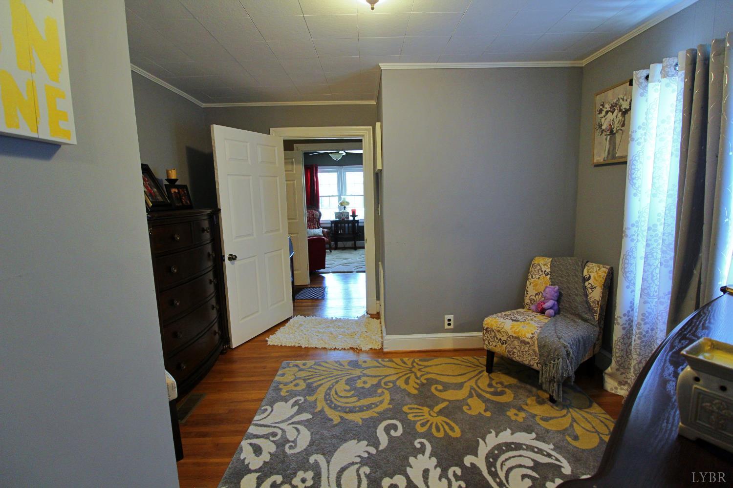 1147 Union Church Road Gladstone, VA 24553 - Photo 35 of 89 a bedroom with a bed and a mirror