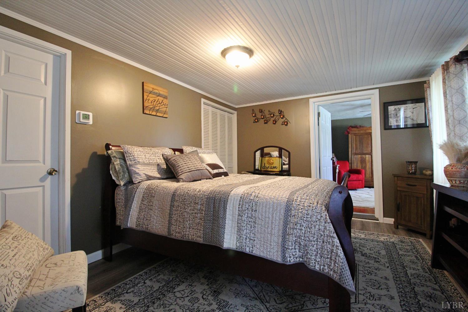 1147 Union Church Road Gladstone, VA 24553 - Photo 37 of 89 a bed room with a bed and a tv