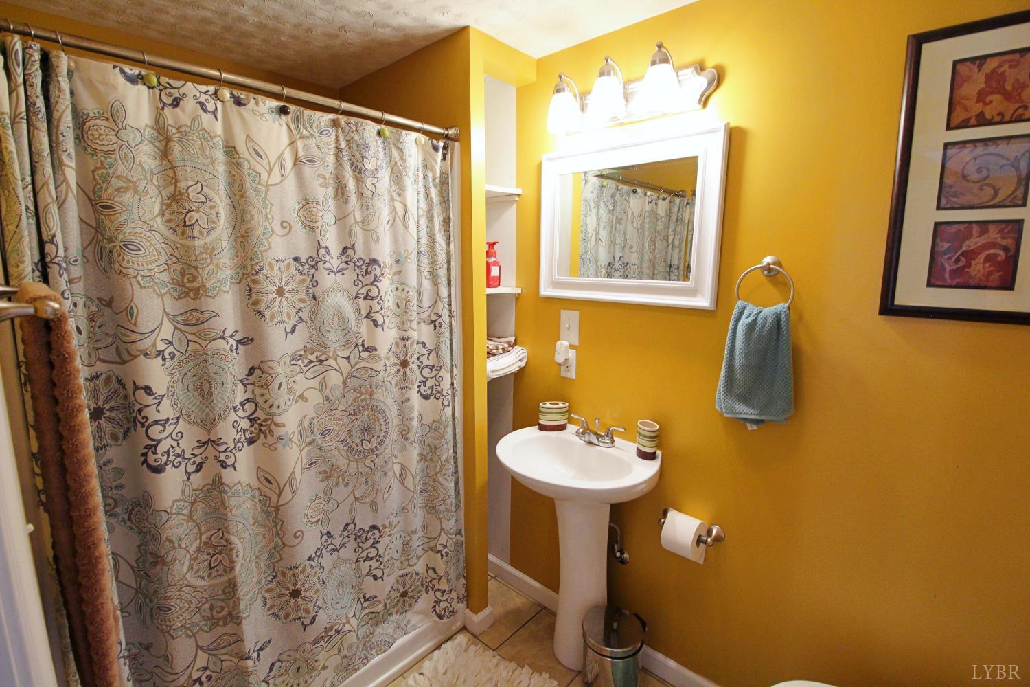 1147 Union Church Road Gladstone, VA 24553 - Photo 39 of 89 a bathroom with a sink a mirror a window and vanity