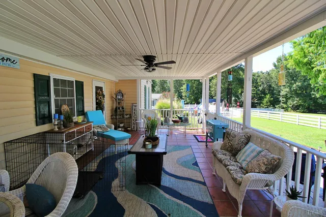 a living room with a couch a fireplace and a flat screen tv