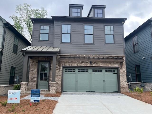 a front view of a house with garage