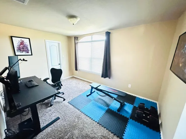 a workspace with furniture and window