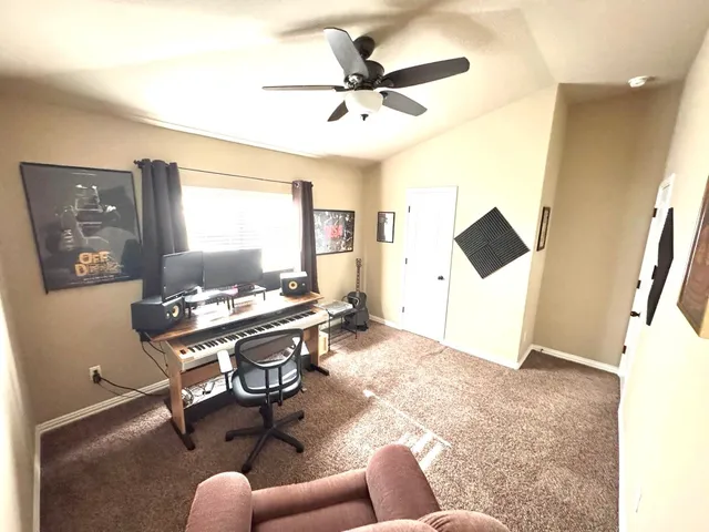 a workspace with furniture and window