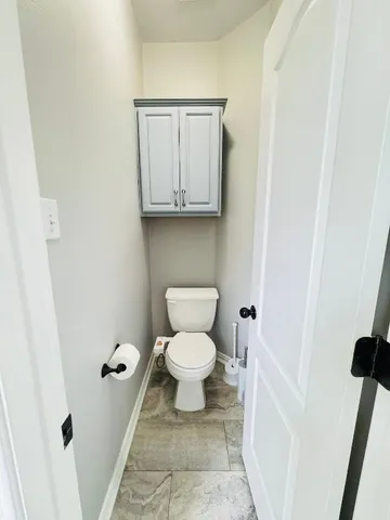 a bathroom with a toilet