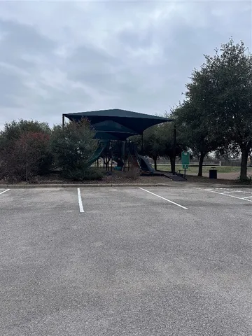 a view of a car park side of the road