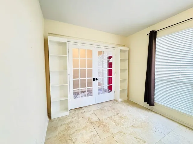 a view of empty room with windows