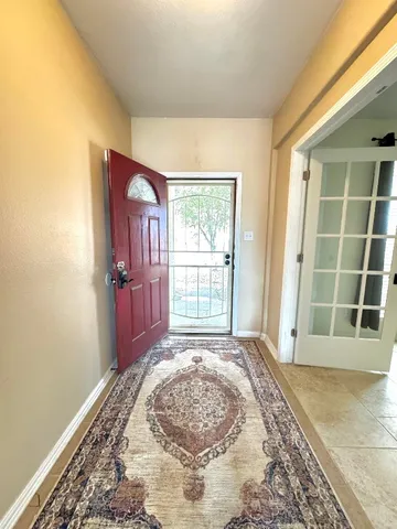 a view of a room with a balcony and window
