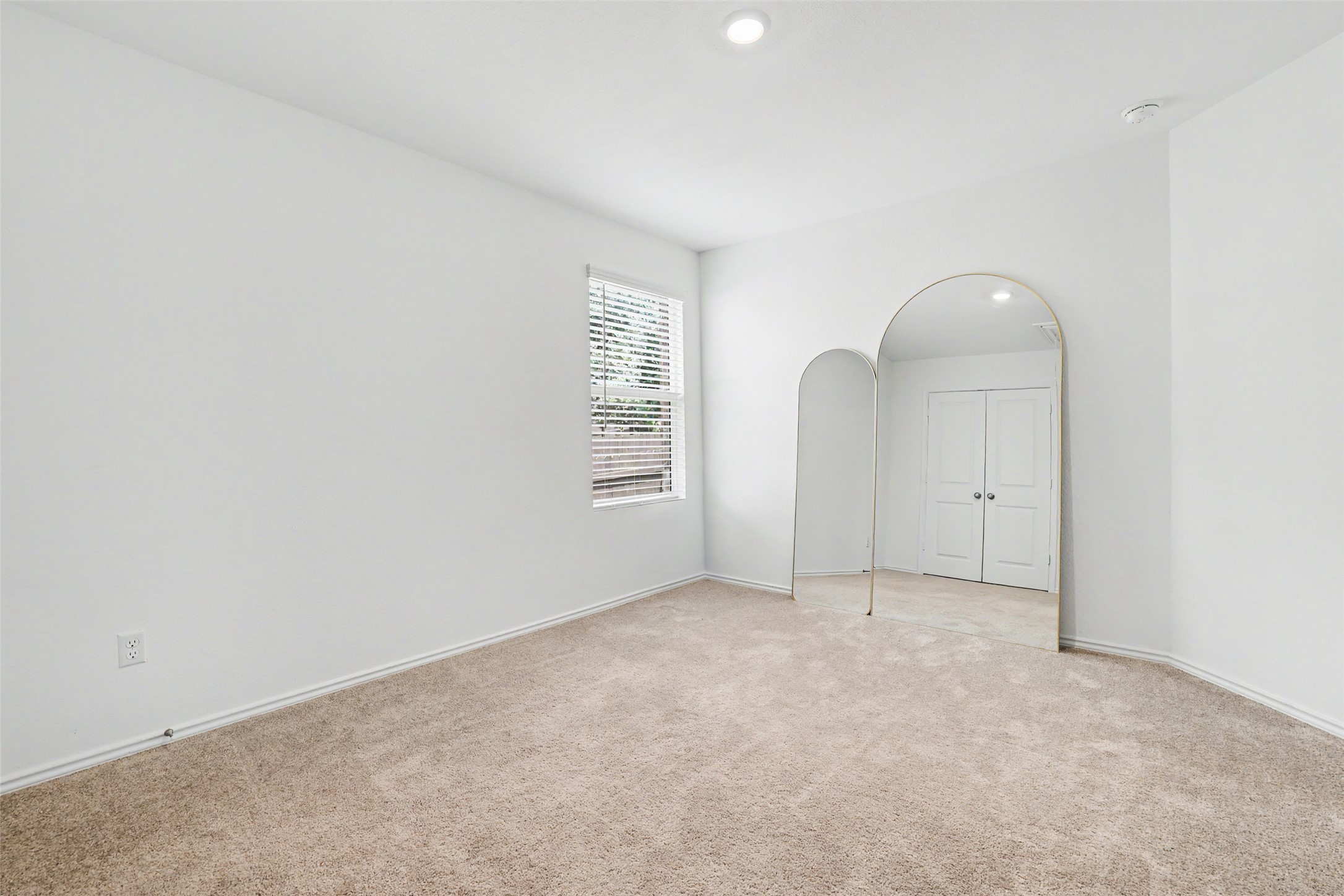 2333 Four Waters Loop Georgetown, TX 78628 - Photo 30 of 35 Carpeted room with a window featuring horizontal blinds