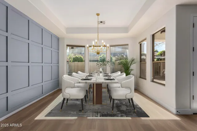 a view of kitchen with stainless steel appliances kitchen island sink stove and refrigerator