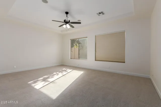 a view of a hallway with wooden floor and closet