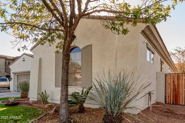 a backyard of a house with outdoor seating