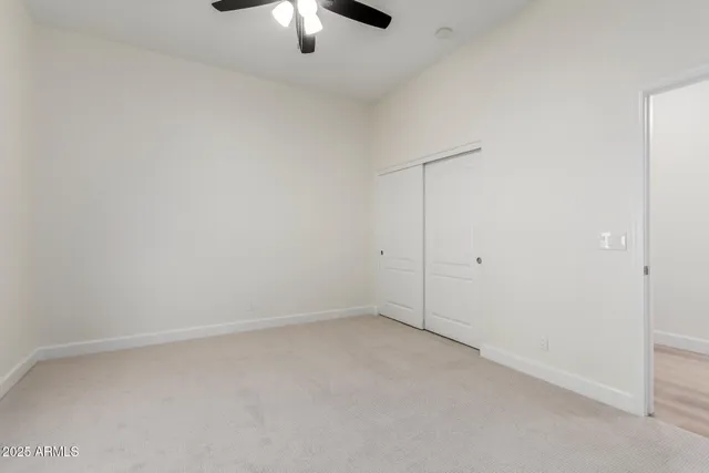 a bathroom with a sink toilet vanity and shower