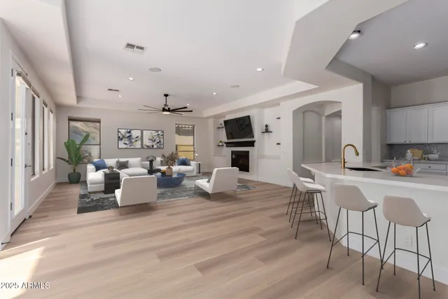 a view of an empty room with a fireplace and a window