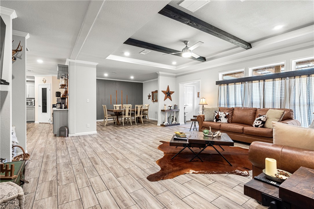 7017 County Road 2253 Odem, TX 78370 - Photo 14 of 40 a living room with furniture and a wooden floor