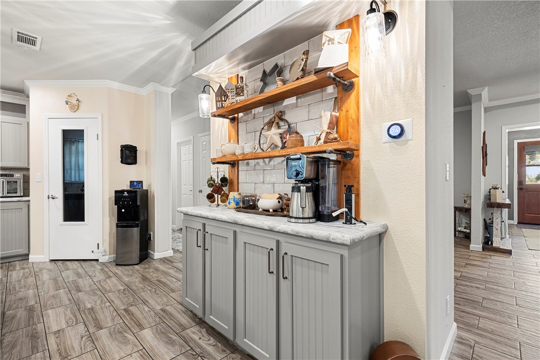 7017 County Road 2253 Odem, TX 78370 - Photo 17 of 40 a kitchen view with stainless steel appliances granite countertop a refrigerator and a cabinets