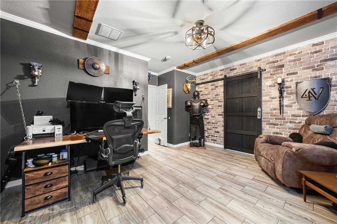 7017 County Road 2253 Odem, TX 78370 - Photo 22 of 40 a bedroom with furniture and a wooden floor