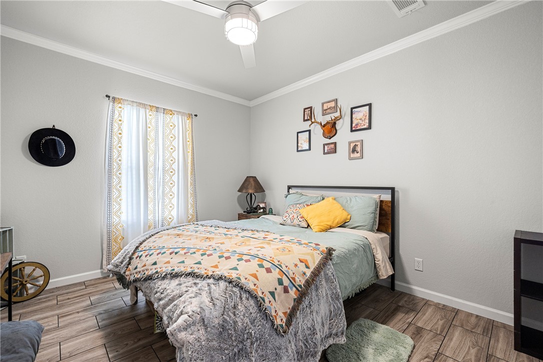 7017 County Road 2253 Odem, TX 78370 - Photo 24 of 40 a bedroom with a bed and a window