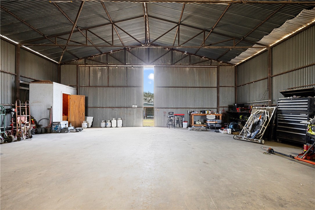 7017 County Road 2253 Odem, TX 78370 - Photo 32 of 40 a view of a garage with storage and utility