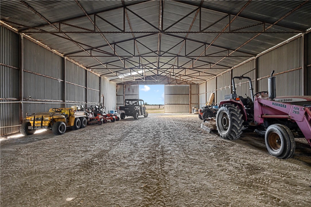 7017 County Road 2253 Odem, TX 78370 - Photo 33 of 40 a view of a garage with a bike and car