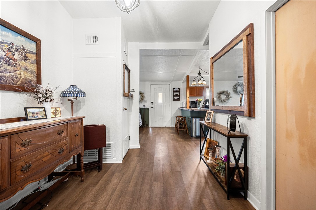 7017 County Road 2253 Odem, TX 78370 - Photo 37 of 40 a view of a hallway with workspace and wooden floor