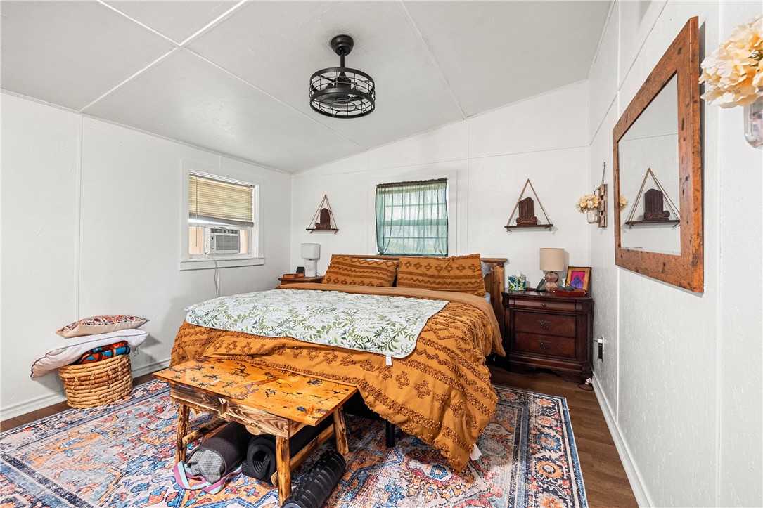 7017 County Road 2253 Odem, TX 78370 - Photo 38 of 40 a bedroom with a bed and wooden floor