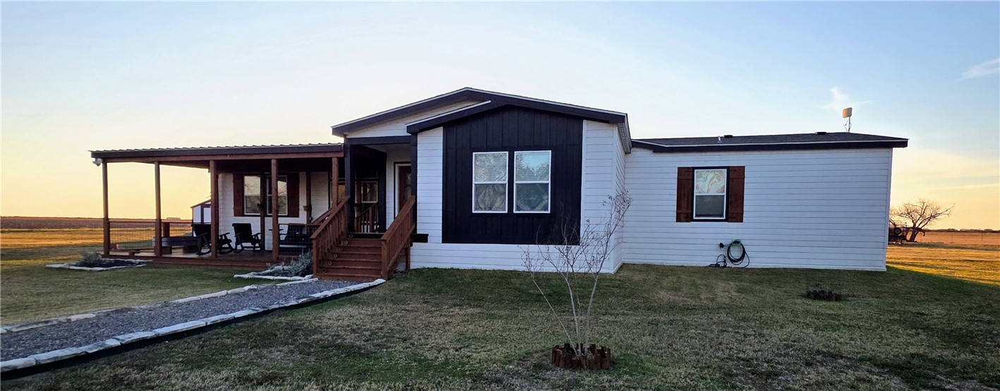 7017 County Road 2253 Odem, TX 78370 - Photo 5 of 40 a view of front of a house with a yard