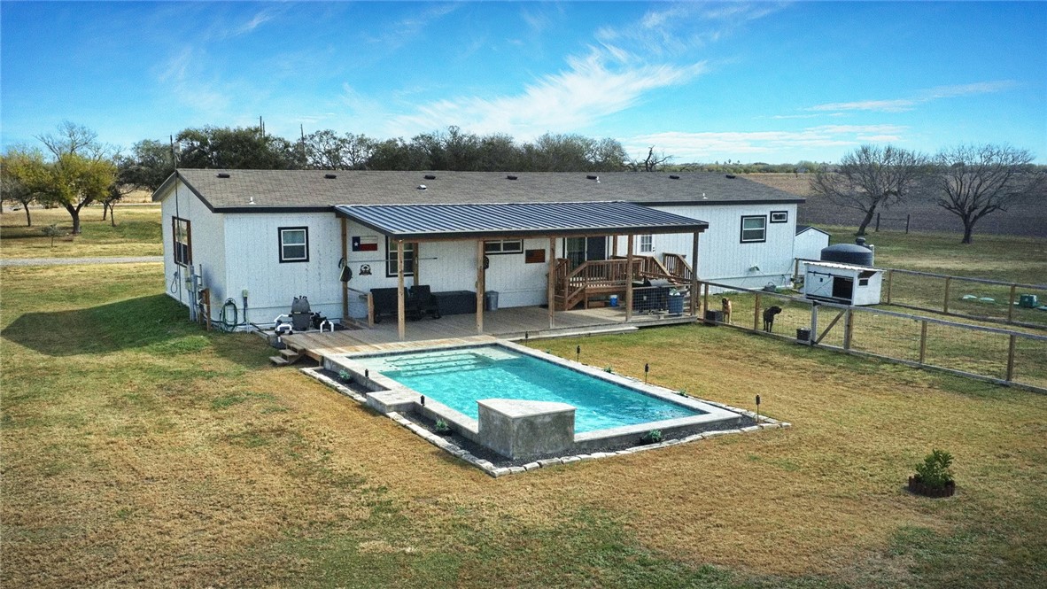 7017 County Road 2253 Odem, TX 78370 - Photo 8 of 40 a view of a house with pool and chairs