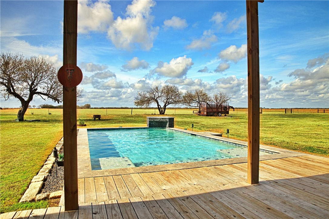 7017 County Road 2253 Odem, TX 78370 - Photo 9 of 40 a view of a swimming pool with a ocean view