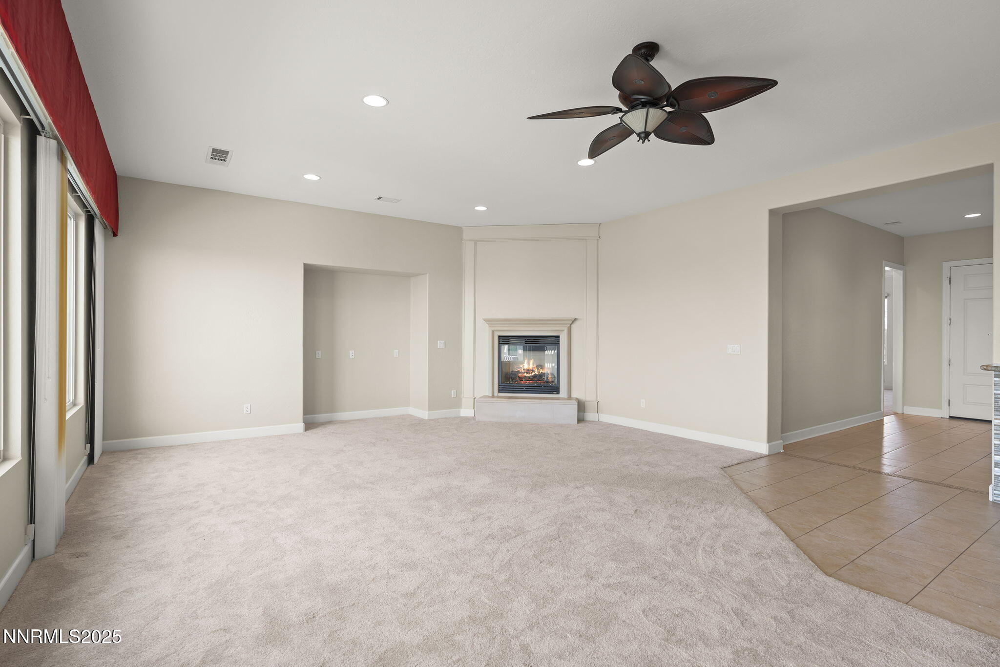 9190 Quilberry Way Reno, NV 89523 - Photo 18 of 39 an empty room with fan and windows