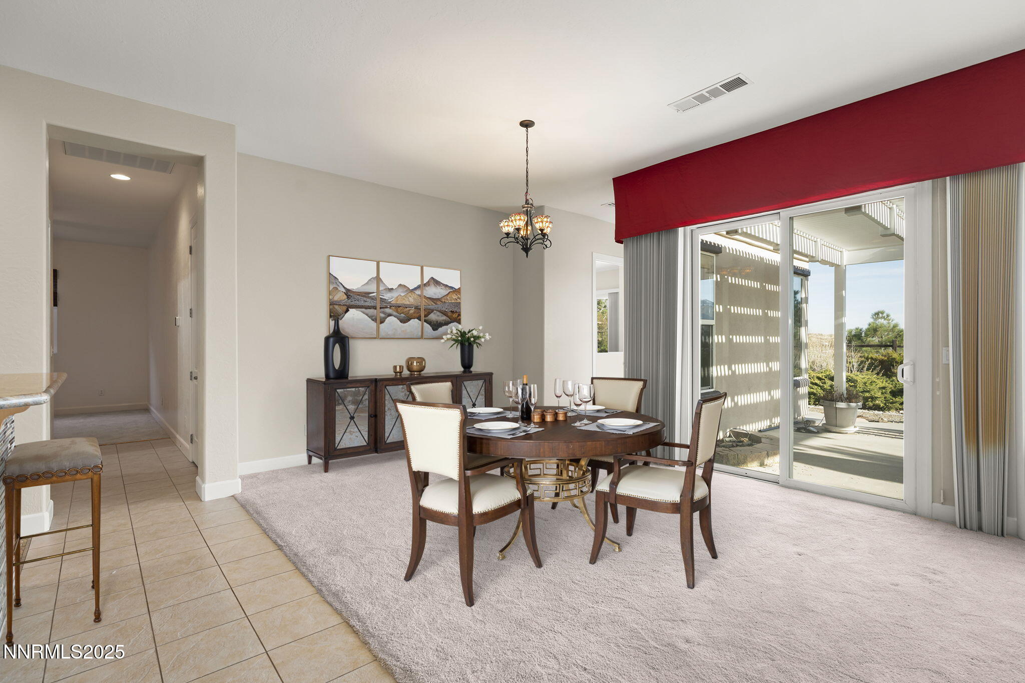 9190 Quilberry Way Reno, NV 89523 - Photo 20 of 39 a dining room with furniture a chandelier and fireplace