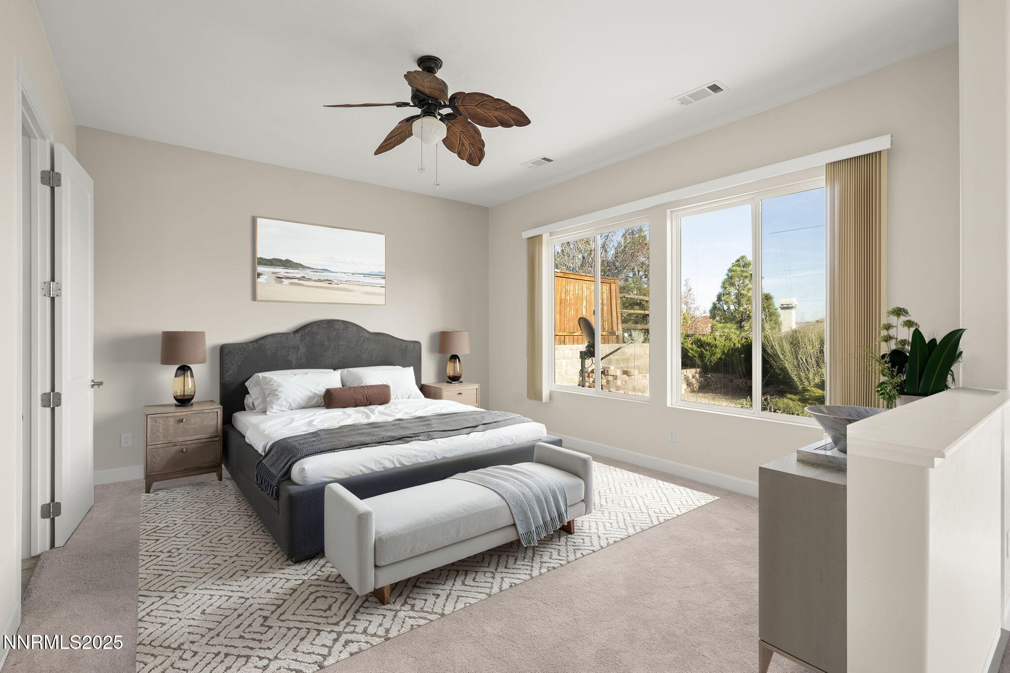 9190 Quilberry Way Reno, NV 89523 - Photo 22 of 39 a bedroom with a large bed chandelier and a window