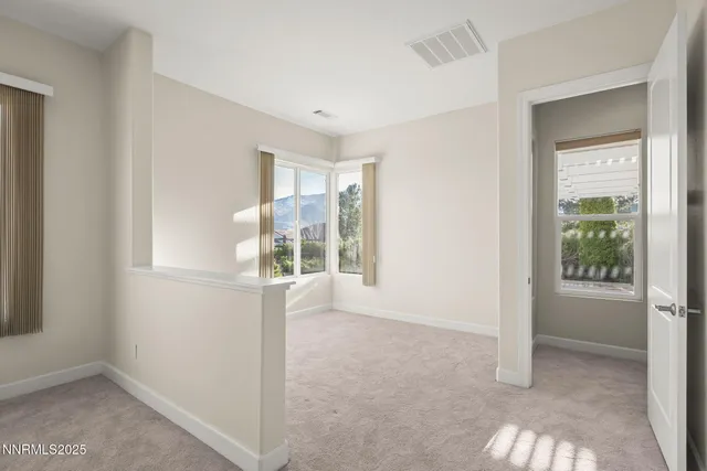 an empty room that has a window