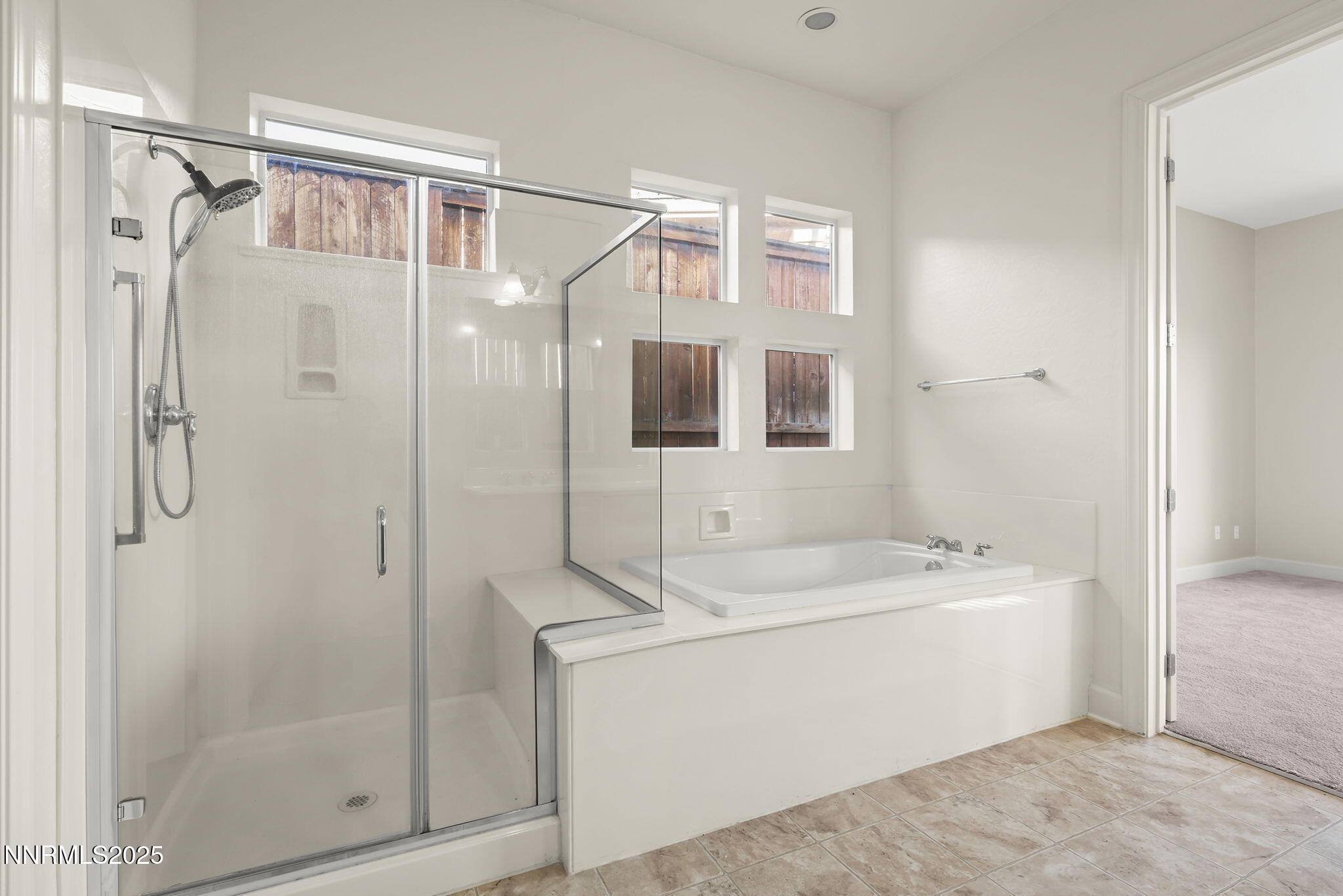 9190 Quilberry Way Reno, NV 89523 - Photo 26 of 39 a bathroom with a shower a mirror and a sink
