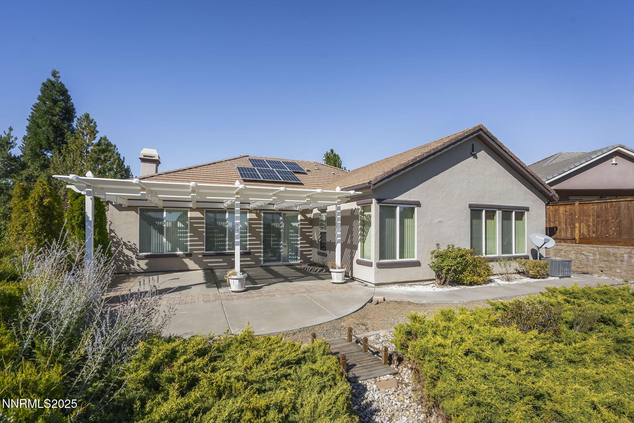 9190 Quilberry Way Reno, NV 89523 - Photo 35 of 39 a front view of a house with a yard