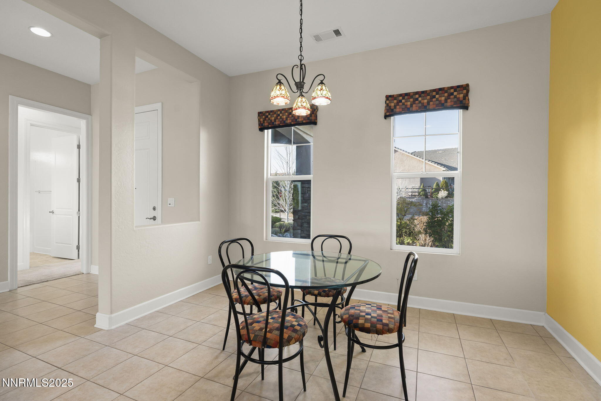 9190 Quilberry Way Reno, NV 89523 - Photo 8 of 39 a view of a dining room with furniture and window