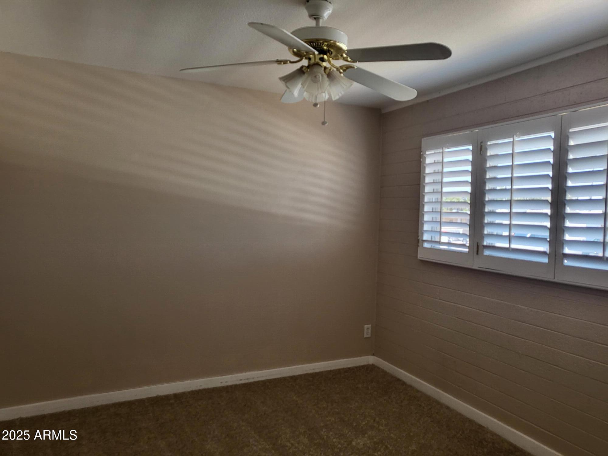 815 North Hayden Road, Unit A204 Scottsdale, AZ 85257 - Photo 11 of 27 an empty room with a window and a fan