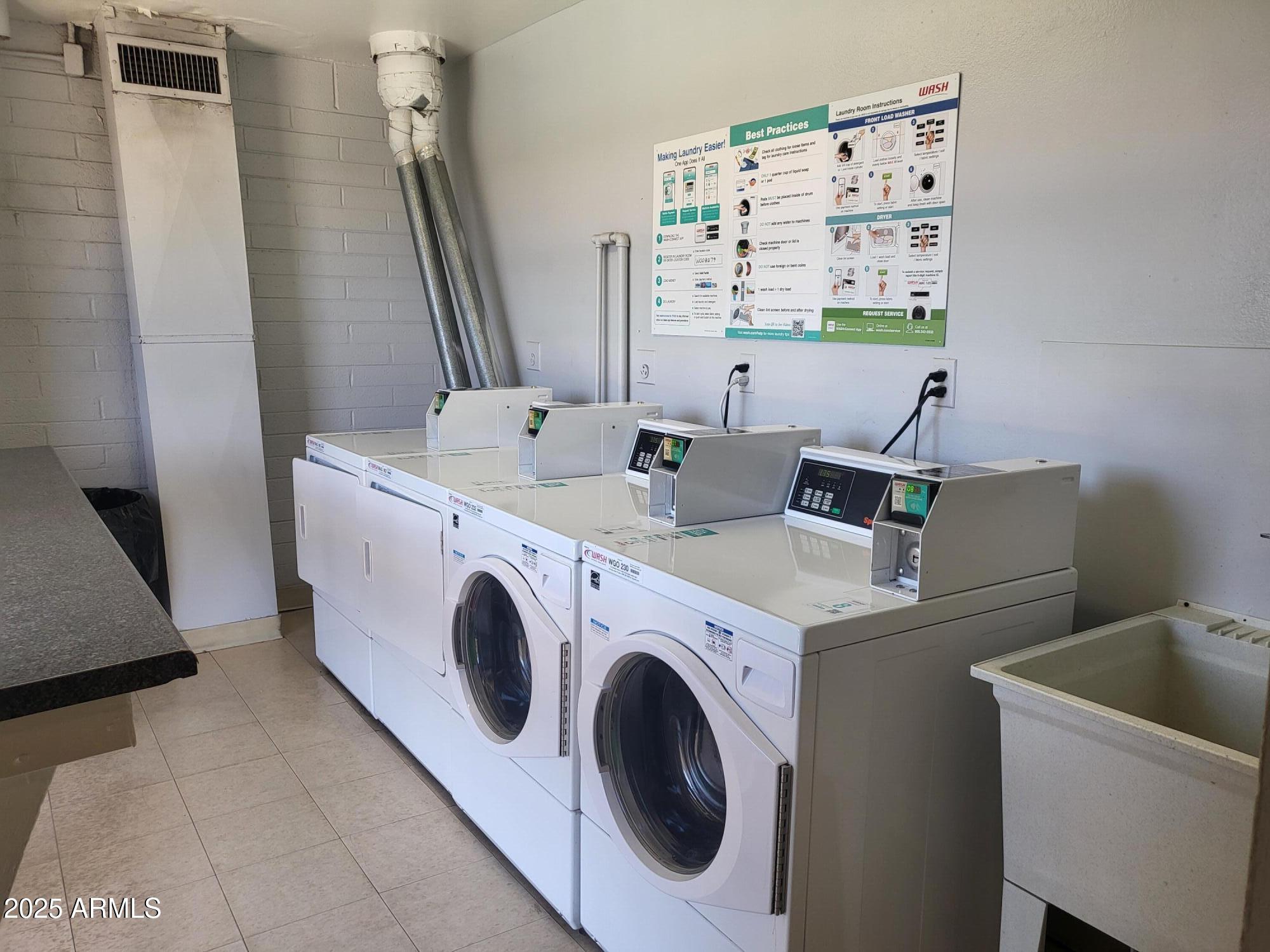 815 North Hayden Road, Unit A204 Scottsdale, AZ 85257 - Photo 20 of 27 a utility room with dryer and washer