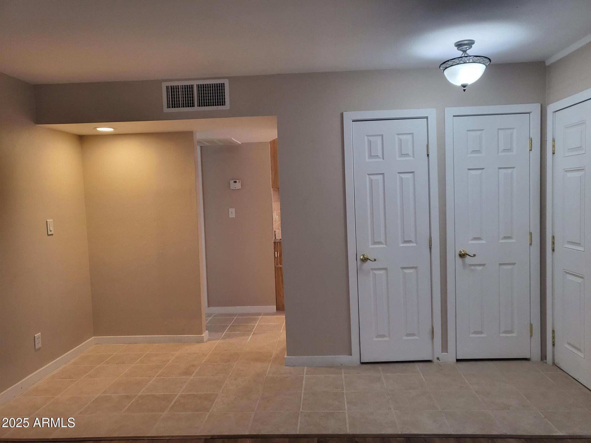 815 North Hayden Road, Unit A204 Scottsdale, AZ 85257 - Photo 3 of 27 an empty room with closet area