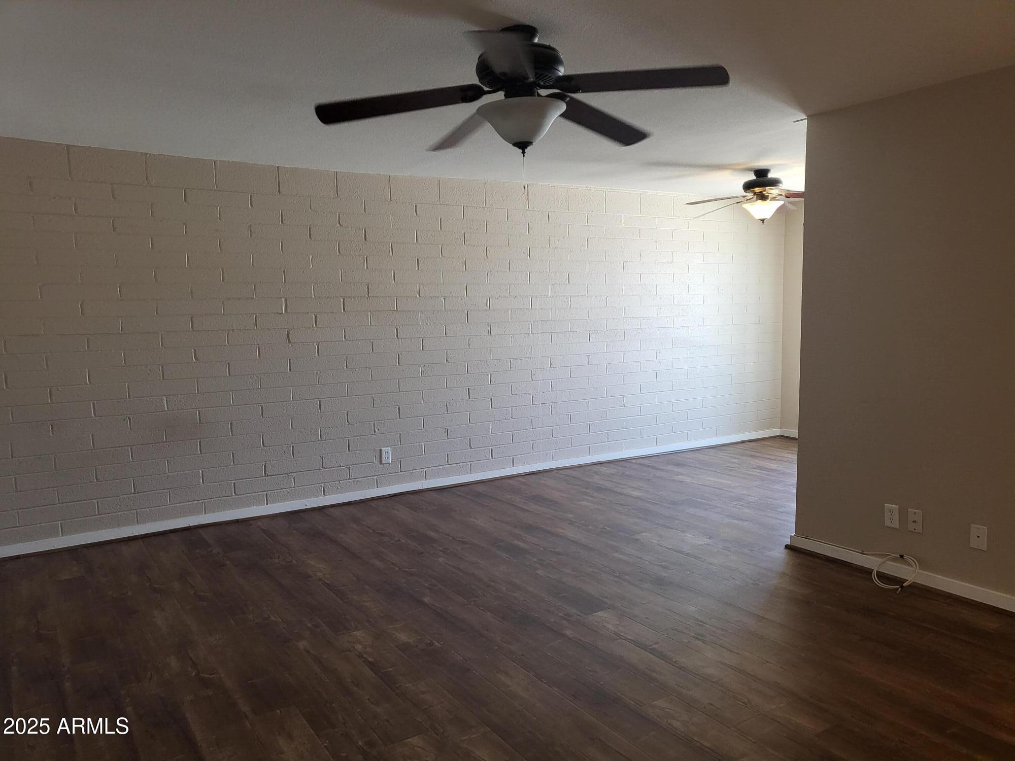 815 North Hayden Road, Unit A204 Scottsdale, AZ 85257 - Photo 6 of 27 wooden floor in an empty room