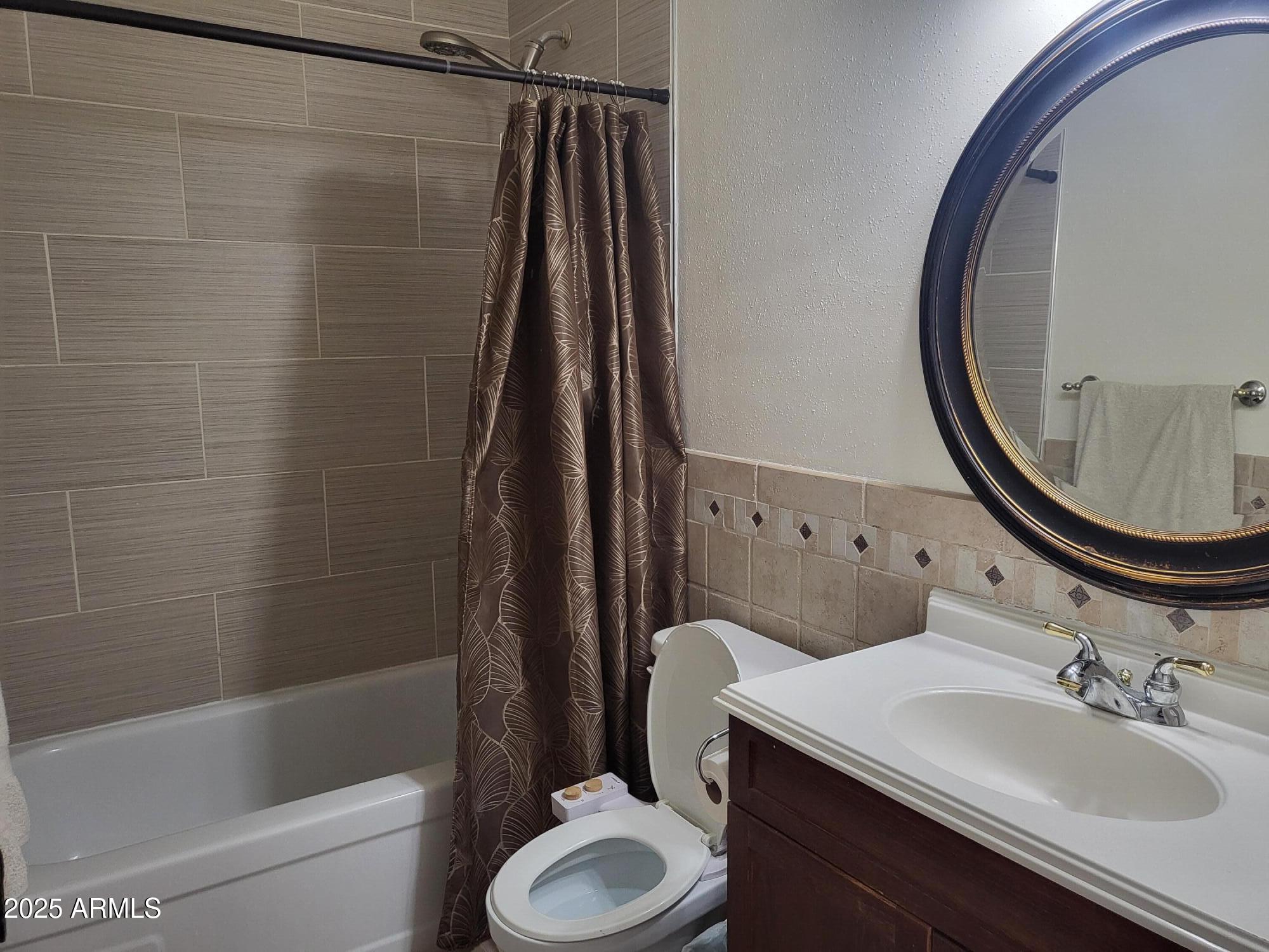815 North Hayden Road, Unit A204 Scottsdale, AZ 85257 - Photo 10 of 27 a bathroom with a sink toilet and shower