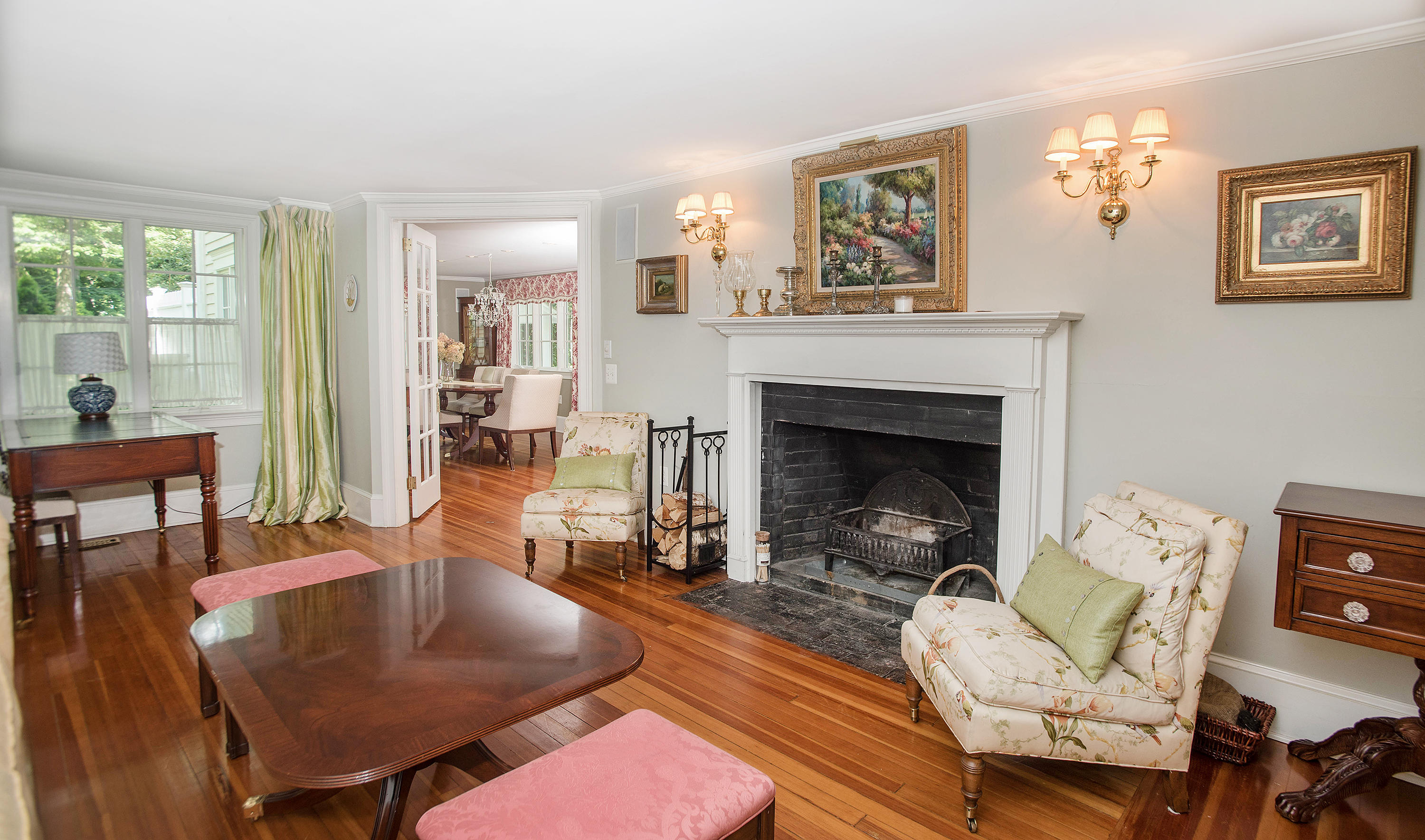 103 Jelliff Mill Road New Canaan, CT 06840 - Photo 13 of 30 a living room with furniture a table and a fireplace