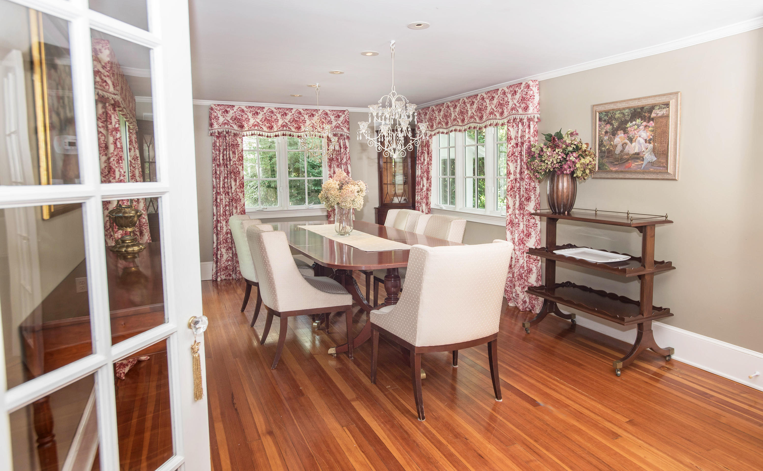 103 Jelliff Mill Road New Canaan, CT 06840 - Photo 14 of 30 a view of a dining room with furniture window and wooden floor