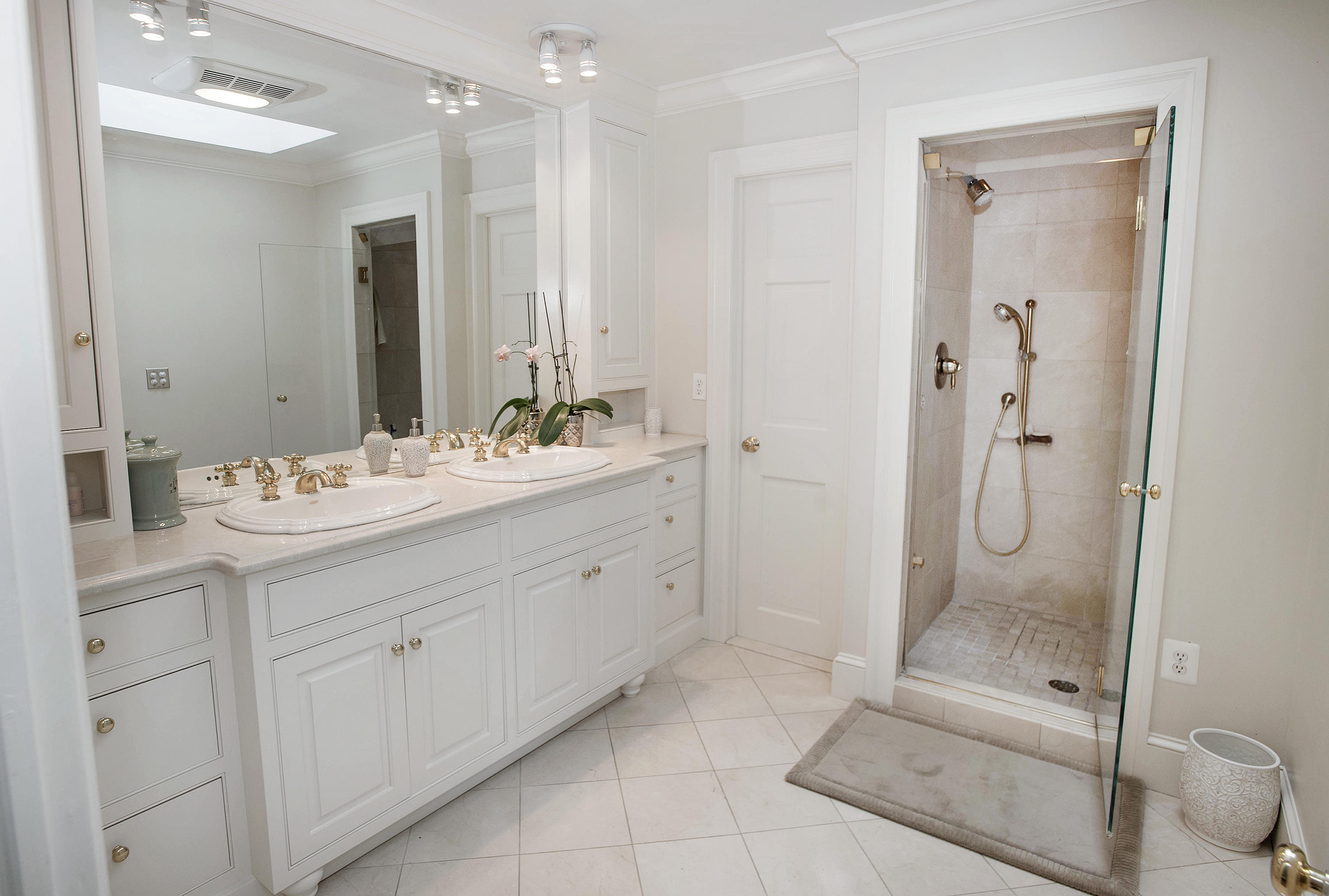 103 Jelliff Mill Road New Canaan, CT 06840 - Photo 17 of 30 a bathroom with a shower sink and mirror