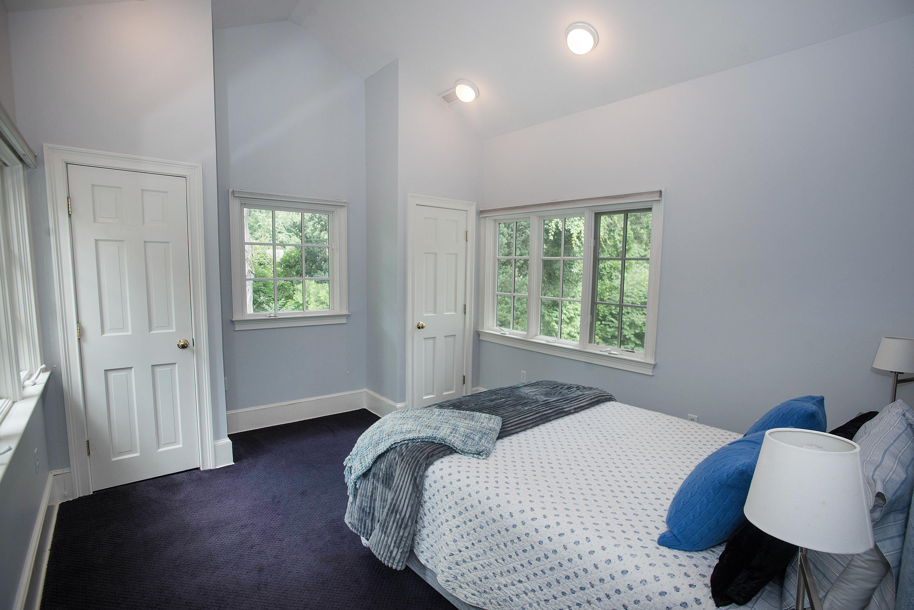 103 Jelliff Mill Road New Canaan, CT 06840 - Photo 18 of 30 a bedroom with a bed and a window